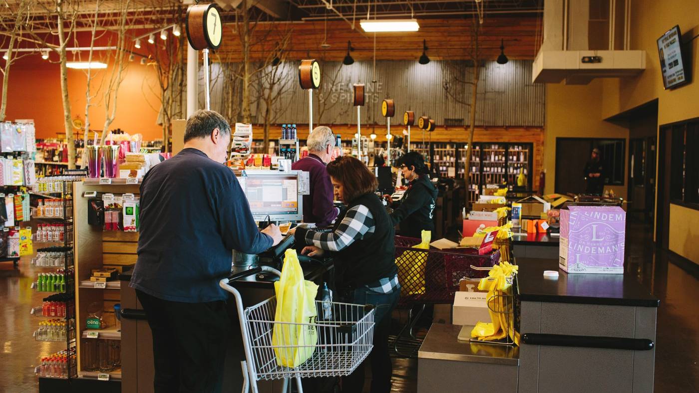 Busy checkout lanes inside a real mPower customer store