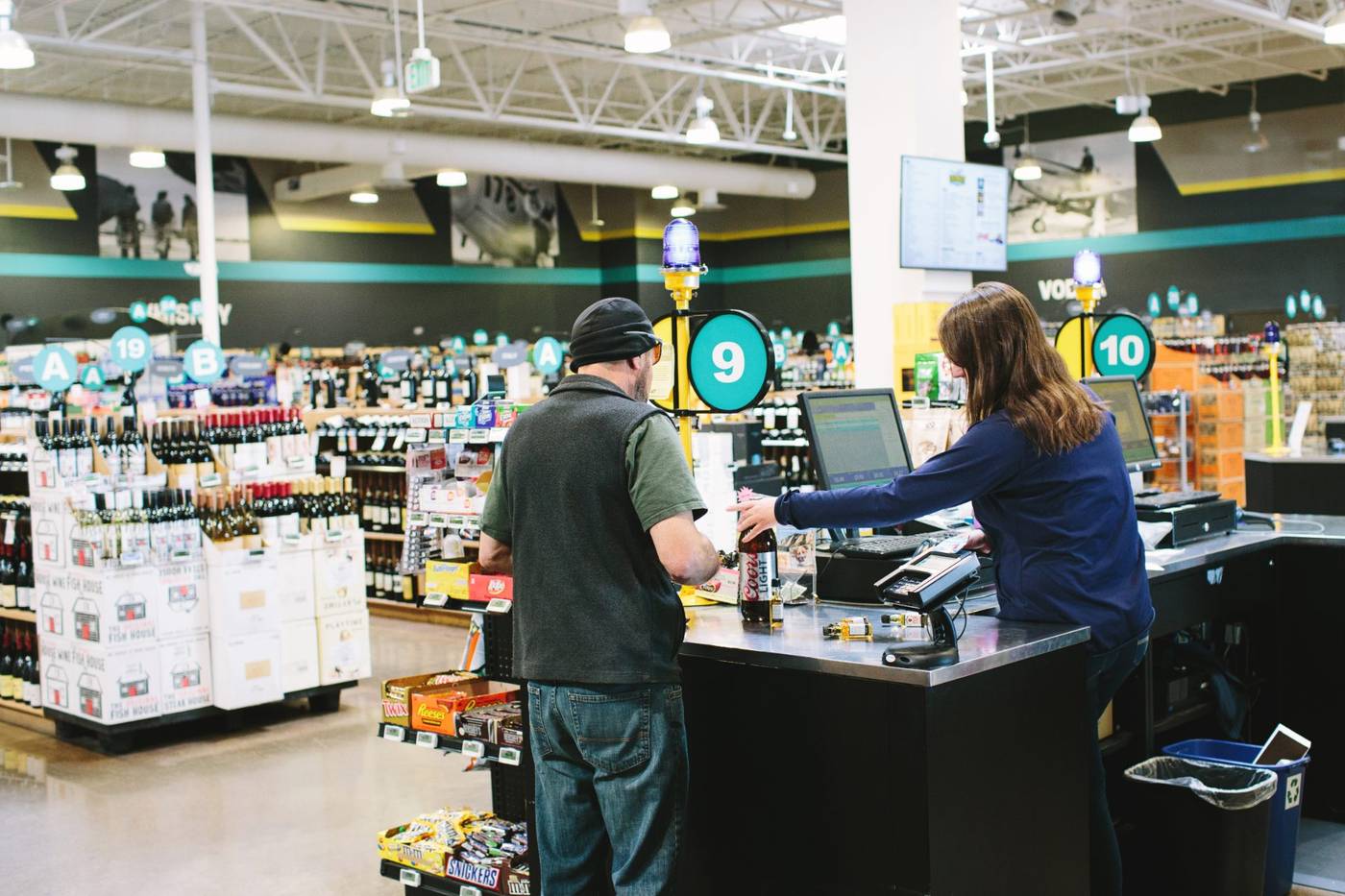 Team members working the checkout lanes of a real mPower customer store